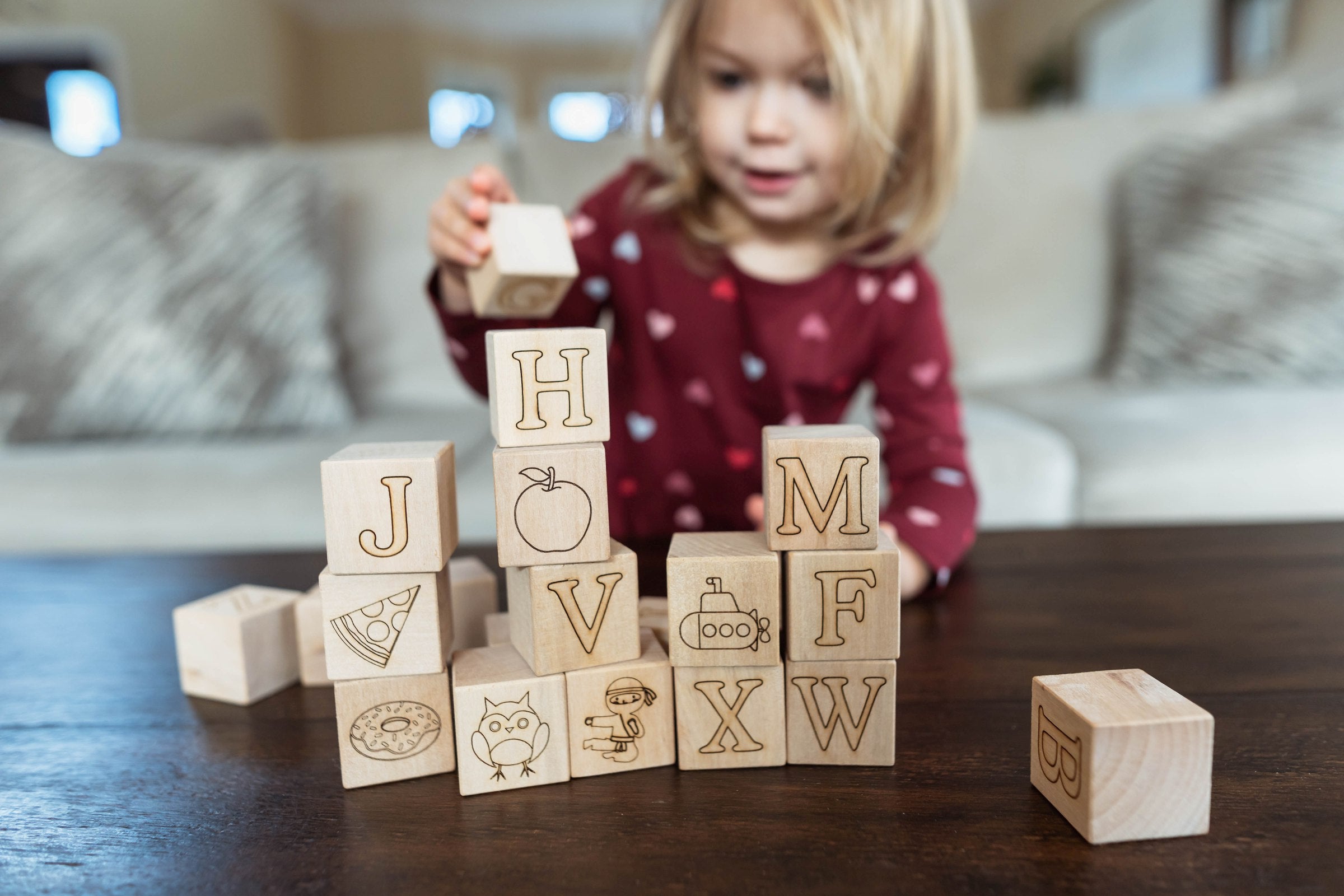 Child playing with wooden blocks