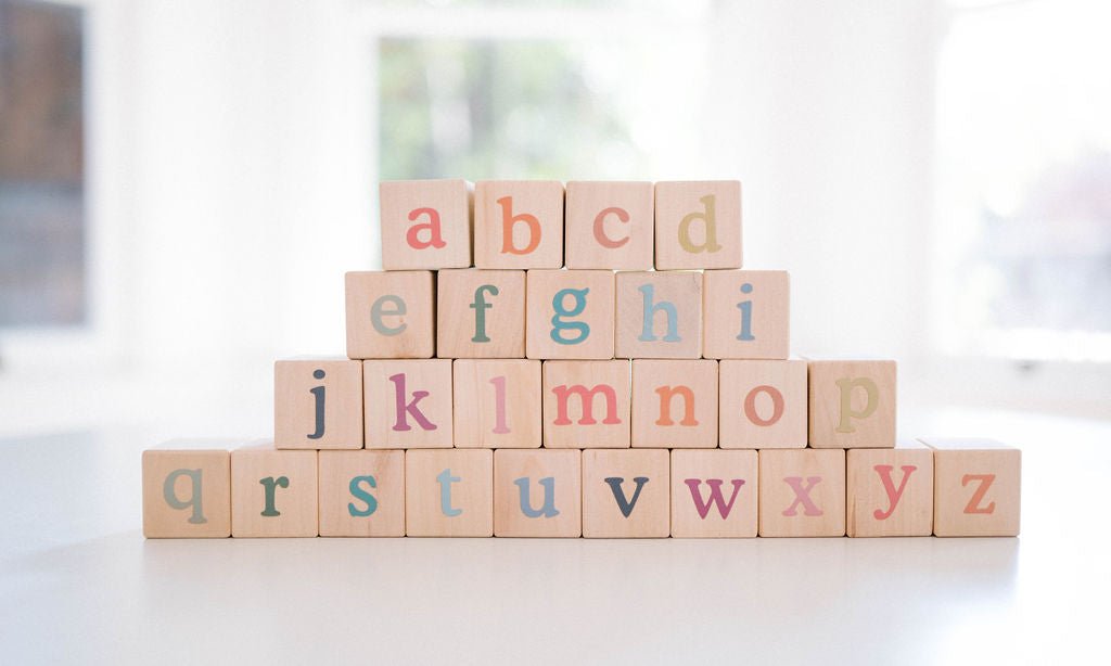 Wooden building deals blocks with letters